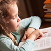 little girl reading a book