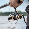 fisherman holding reel close up