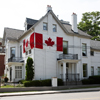 house with Canada flags on exterior walls