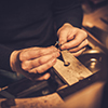 Jeweler at work in jewelery workshop