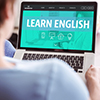 Learn English text on laptop