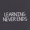 LEARNING NEVER ENDS concept - book with various supplies
