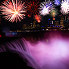 Niagara falls at dusk view with celebration fireworks in the night sky