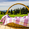 Picnic basket on wooden table