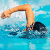 Close up of person swimming in a pool