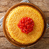 Iranian tahchin rice cake with chicken closeup in the plate on the table. horizontal top view from a