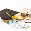 education concept with coins and mortar board