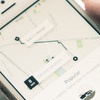 hand showing person using Uber application on iPhone