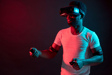 Young Man Wearing VR Headset And Experiencing Virtual Reality