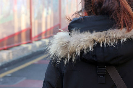 back view of woman in winter jacket