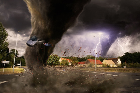 View of a large tornado destroying an entire city