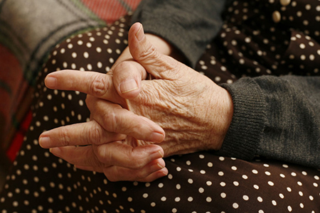 Hands of the elderly woman close-up