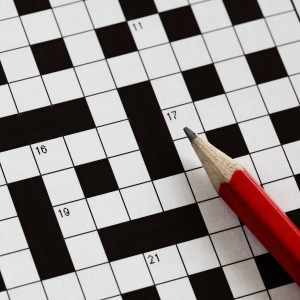 crossword puzzle with red pencil