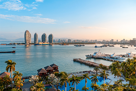 The geometrically streamlined modern building built on the sea at dusk in Sanya city Southern China