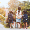 Back to school. Asian pupil kids with backpack going to school together in vintage color tone