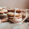 Close up of homemade ginger cookies, cinnamon, ginger on a wooden table. Copy space. Vintage toned i