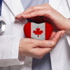 Canadian doctor holding heart with flag of Canada background. Healthcare, charity, insurance and med