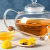 Healthy dandelion tea with honey on table