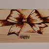 Wooden box with pyrography art - bow shape burned on to box