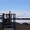 landscape of nunavut with airplane landing in distance