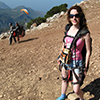 photo of author on mountaintop preparing to paraglide