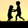 silhouette of brothers playing outside