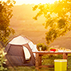 Tent set up with breakfast table at sunrise
