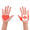 hands up with canada flag and heart printed on each hand