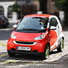 Red electric Smart Car charging