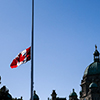 canada flag at half mast - Parliament Buildings in Victoria and Provincial Government Buildings in M