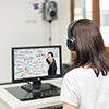 Asian woman student video conference e-learning with teacher on computer in IT room at university. E