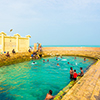Keerimalai, Sri Lanka - February 5, 2015: Sri Lankan swimmers enjoy the Keerimalai Hot Springs, a to