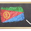 Blackboard with the national flag of Eritrea drawn on and a chalk