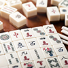 mahjong tiles on wooden table
