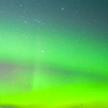 Intense northern lights (Aurora borealis) over lake