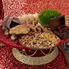 Novruz tray with Azerbaijan national desserts against silk scarf background