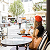 Woman having a french breakfast at the cafe