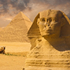 sphinx with pyramids in back