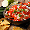 Mexican pico de gallo from tomatoes, onions, cilantro and jalapeno pepper close-up in a bowl and nac