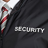 Close-up Of Security Guard Wearing Uniform With The Text Security