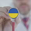 Doctor listening with the stethoscope with flag of Ukraine. Ukrainian healthcare