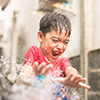 boy being sprayed with water
