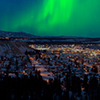 Strong northern lights Aurora borealis substorm on night sky over downtown Whitehorse, capital of th