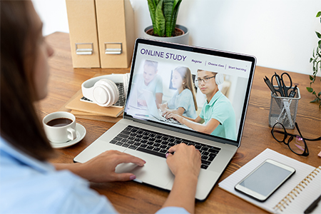 Young woman, distant learning, online on laptop