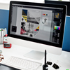 Designer is working on a drawing tablet and Desktop