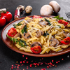 Pasta fettuccine with Alfredo sauce in wooden plate