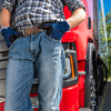 Truck Driver Standing Next to white truck