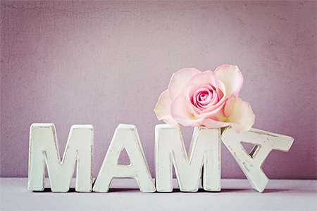 the word 'MAMA' stands beside a delicate pink rose