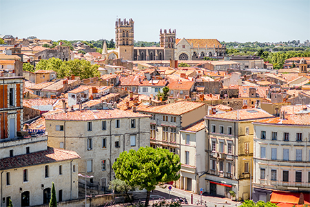 Aerial cityscape view on the old town with cathedral in Montpellier city during the sunny weather in