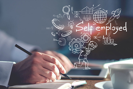 Hand of man writing at office table in blurred room with self employed sketch. Concept of startup an